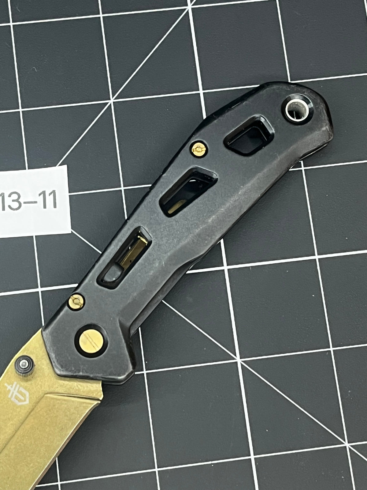 Gerber Paralite folding pocket knife with a gold-toned/bronze titanium nitride coating