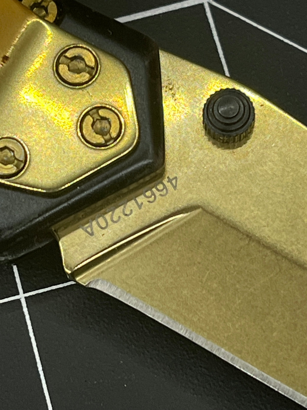 Gerber Paralite folding pocket knife with a gold-toned/bronze titanium nitride coating