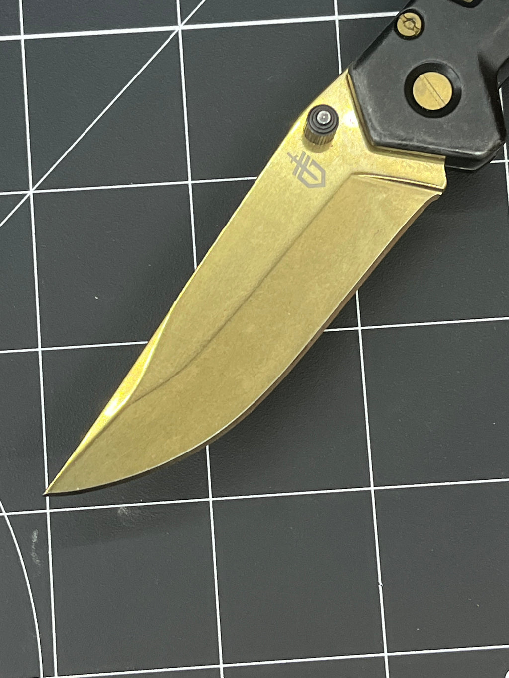 Gerber Paralite folding pocket knife with a gold-toned/bronze titanium nitride coating