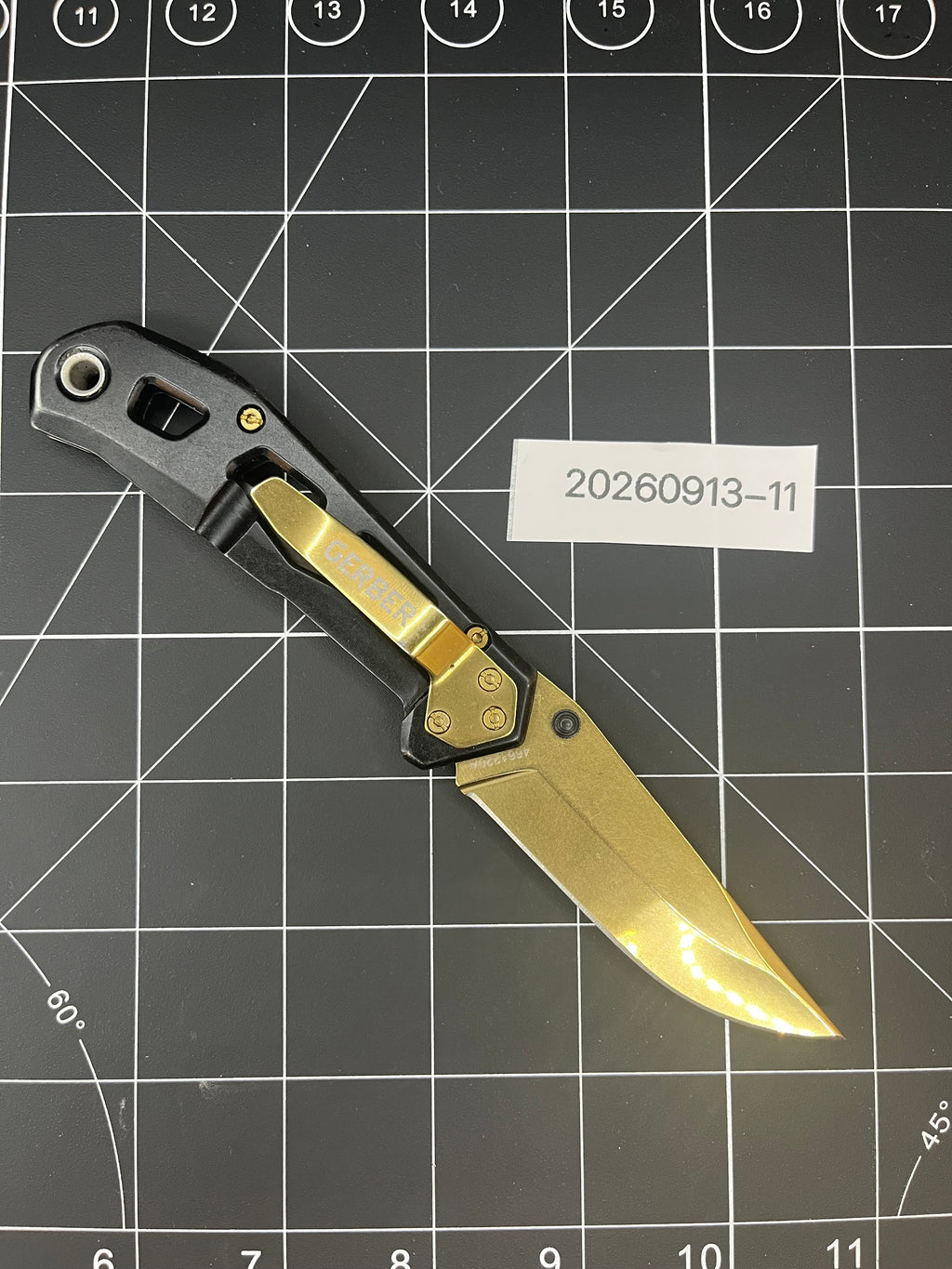 Gerber Paralite folding pocket knife with a gold-toned/bronze titanium nitride coating