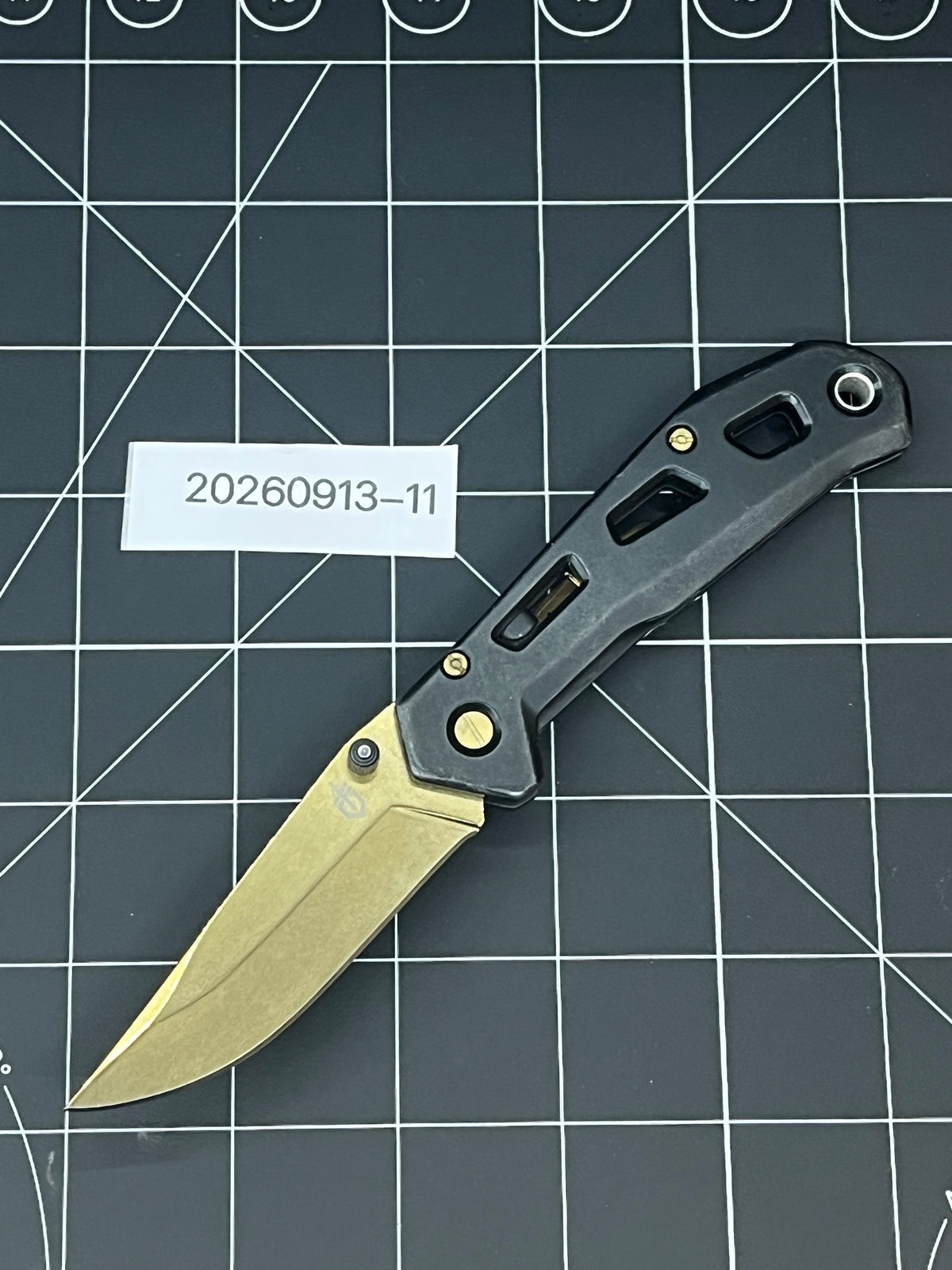 Gerber Paralite folding pocket knife with a gold-toned/bronze titanium nitride coating